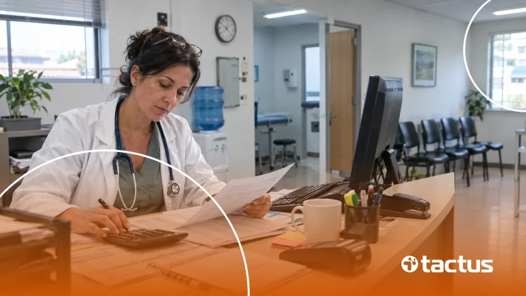Médica confere as contas no balcão do consultório para saber se a clínica médica no Lucro Presumido paga menos imposto do que no Simples Nacional